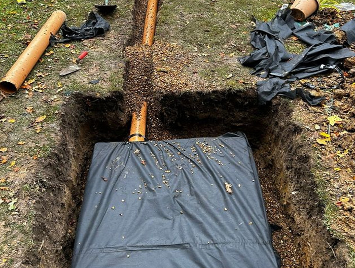 Excavation and pipe installation underway
